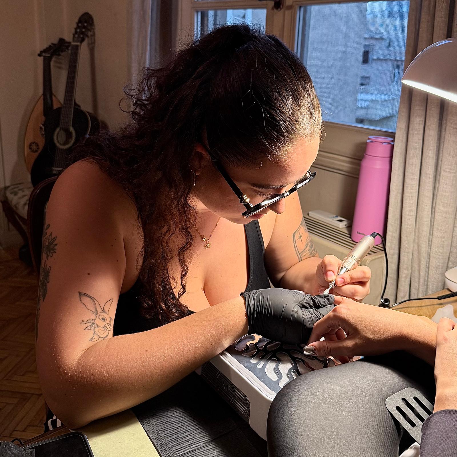 Illona working on a client's nails