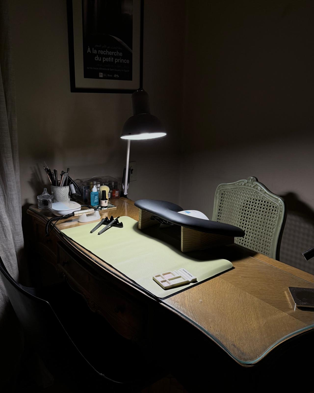 The Tipsy Tips desk, lamp on and set up